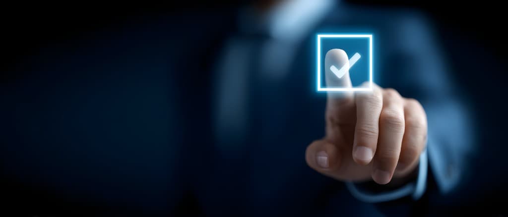 Hand selecting a glowing digital checkmark