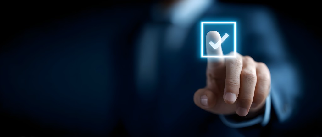 Hand selecting a glowing digital checkmark